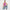 Jane model sitting on the floor wearing a purple tank top and a blue indigo Bubblegum Jeans on a white background