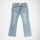 Light wash blue denim Bubblegum jeans with the Jane super low rise, flare leg fit, laid flat on a light gray background.