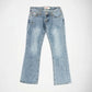 Light blue denim Bubblegum jeans with a star shape embellishment on the left thigh, laid flat against a light gray background.