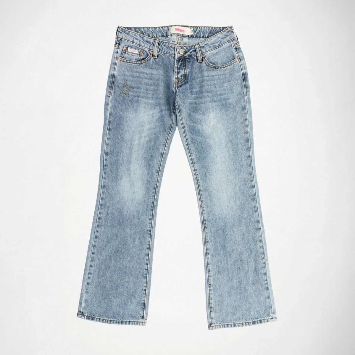 Light blue denim Bubblegum jeans with a star shape embellishment on the left thigh, laid flat against a light gray background.