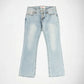 Light wash blue denim Bubblegum jeans with a super low rise, flare leg, with exposed botton fly, laid flat against a white background.