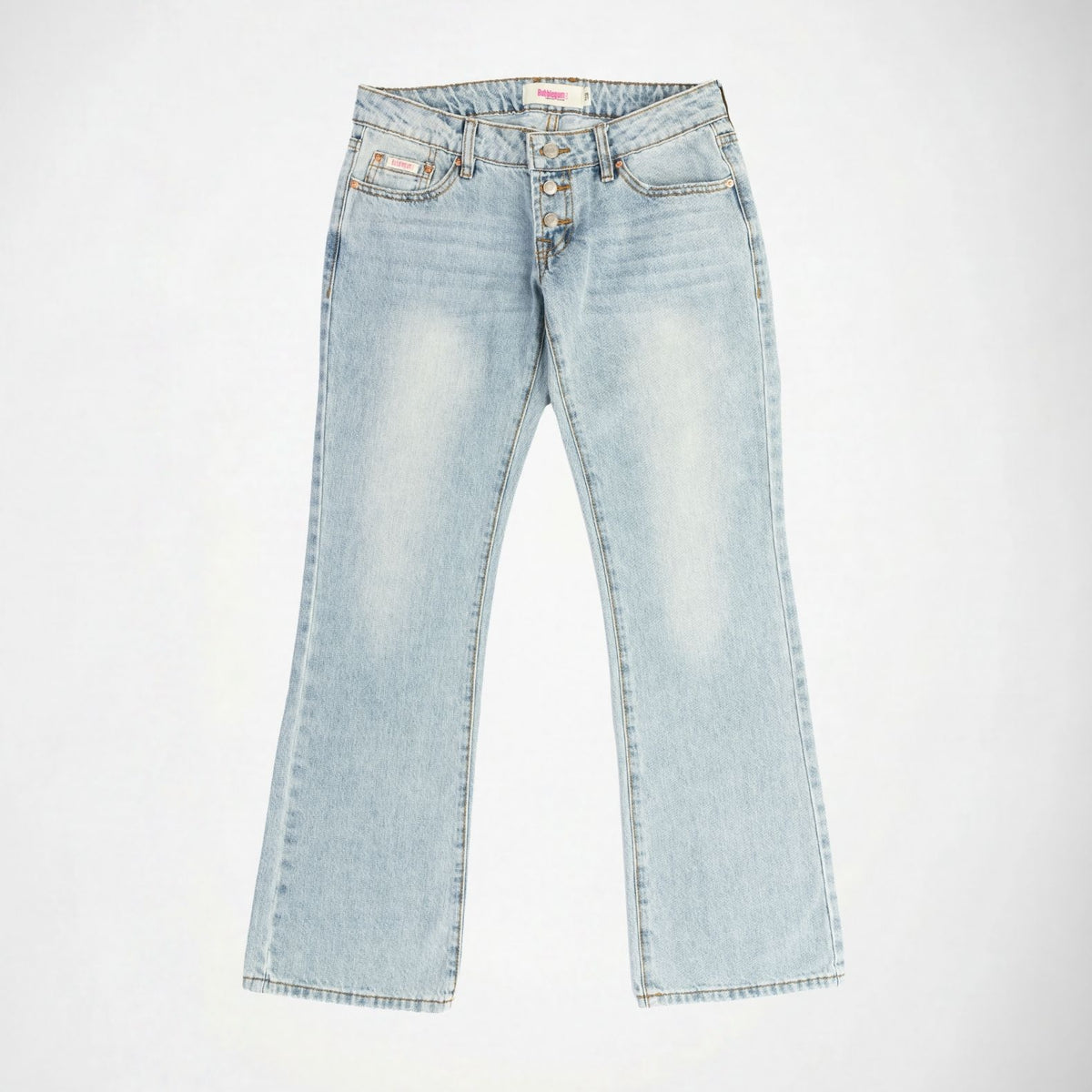 Light wash blue denim Bubblegum jeans with a super low rise, flare leg, with exposed botton fly, laid flat against a white background.