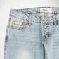 Close-up of a pair of light-wash blue denim Bubblegum jeans showing the waistband, button fly, belt loops, and front pocket details. The brand name 'Bubblegum USA' is visible on the inner waistband label and the front pocket tag.