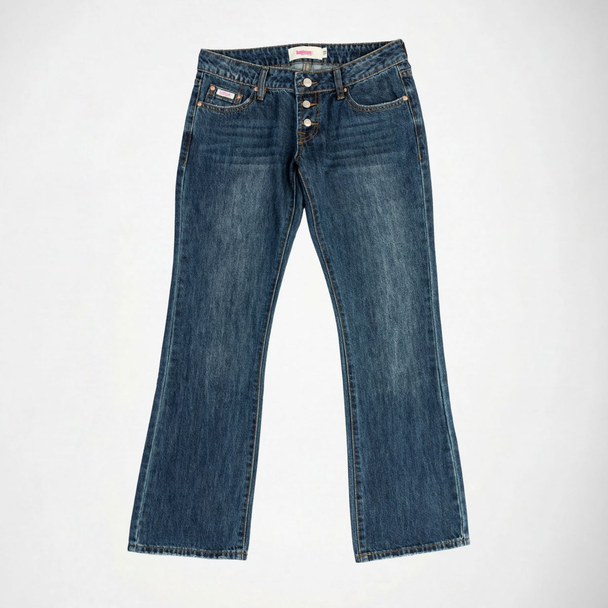 A pair of dark blue denim Bubblegum jeans with a slight flare at the hem, exposed button look laid flat against a light gray background.