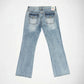 Light blue denim Bubblegum jeans shown from the back, featuring a star embroidery with rhinestones on each pocket and a small colorful Bubblegum USA brand label at the back waistband, photographed on a clean white background.