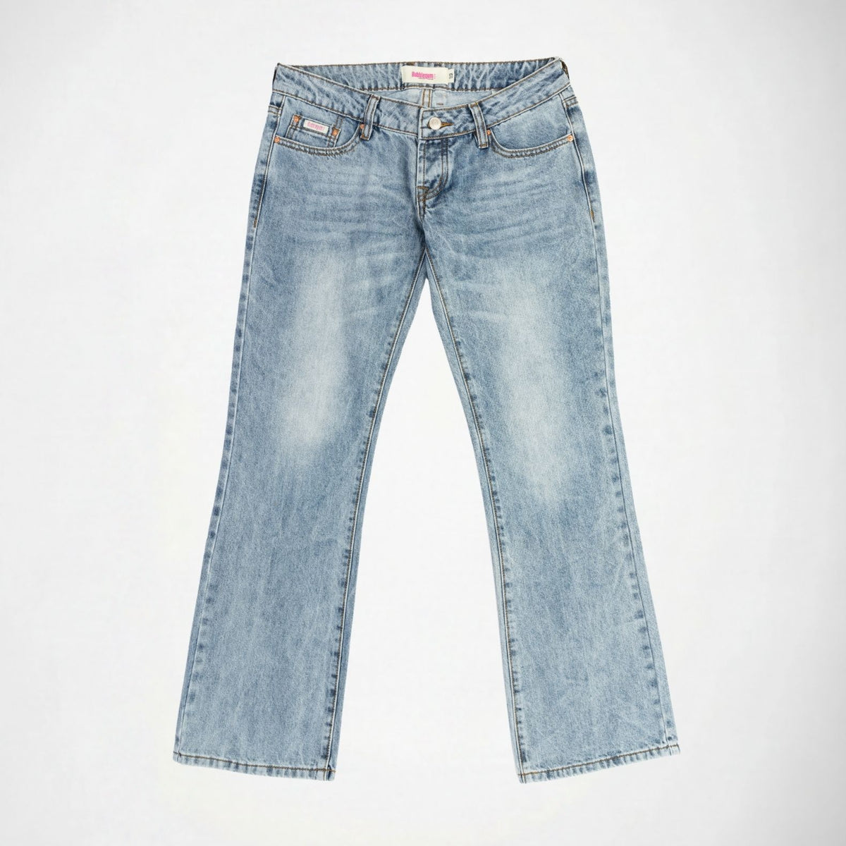 Light blue denim Bubblegum jeans with a super low rise, flare leg, featuring light wash fading on the thighs and a visible Bubblegum USA logo patch on the front right pocket, laid flat against a white background.