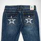 Back view of blue denim Bubblegum jeans with white embroidered stars and rhinestones on both back pockets and a visible 'Bubblegum USA' brand label at the waistband.