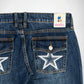 Close-up of the back of dark blue denim Bubblegum jeans showing the waistband, belt loops, back pockets, and a white embroidered star on the right pocket. A Bubblegum USA brand label is visible at the back waist.