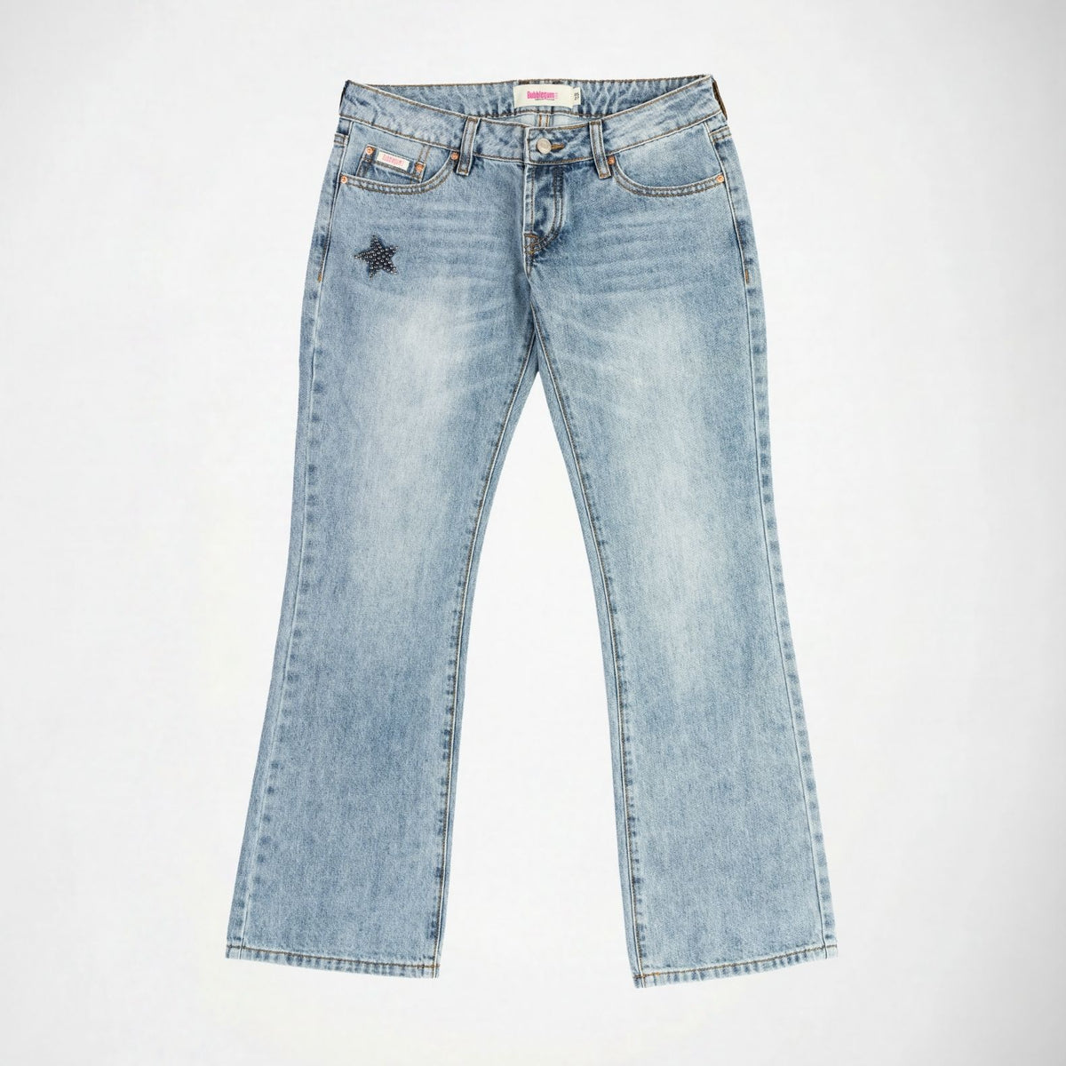 Light wash blue denim Bubblegum jeans with a faded star studded embellishment on the left pocket, photographed flat against a white background. 