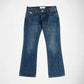 A pair of medium-wash blue Bubblegum denim jeans with a small silver star embellishment on the left hip, displayed flat against a plain white background.
