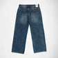 Back view of a pair of blue denim Bubblegum jeans with a mid rise, wide leg, laid flat on a white background.