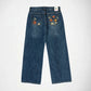 The Lisa low baggy wide in mid rise, wide leg fit in indigo vintage wash denim Bubblegum jeans with flower embroidery in both back pockets, with Bubblegum USA label on a white background