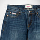 Close-up of a pair of dark blue denim Bubblegum jeans showing the waistband, belt loops, front pockets, rivets, and a visible Bubblegum USA brand label.
