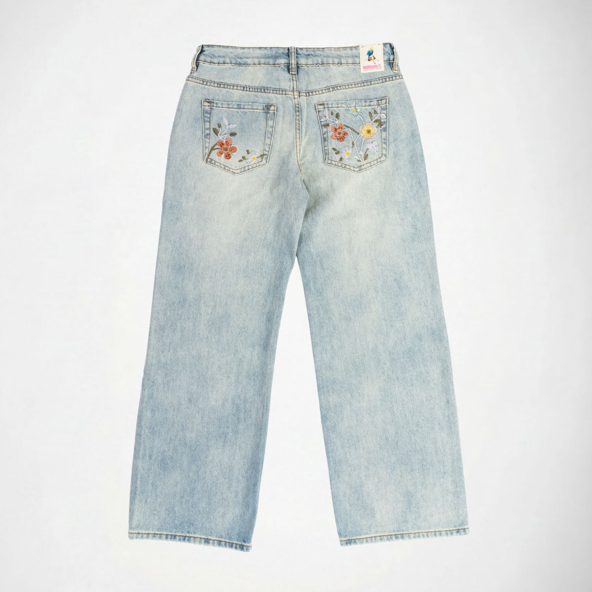 Light wash blue denim Bubblegum jeans shown from the back, featuring floral embroidery on both back pockets and a Bubblegum USA patch at the waistband.