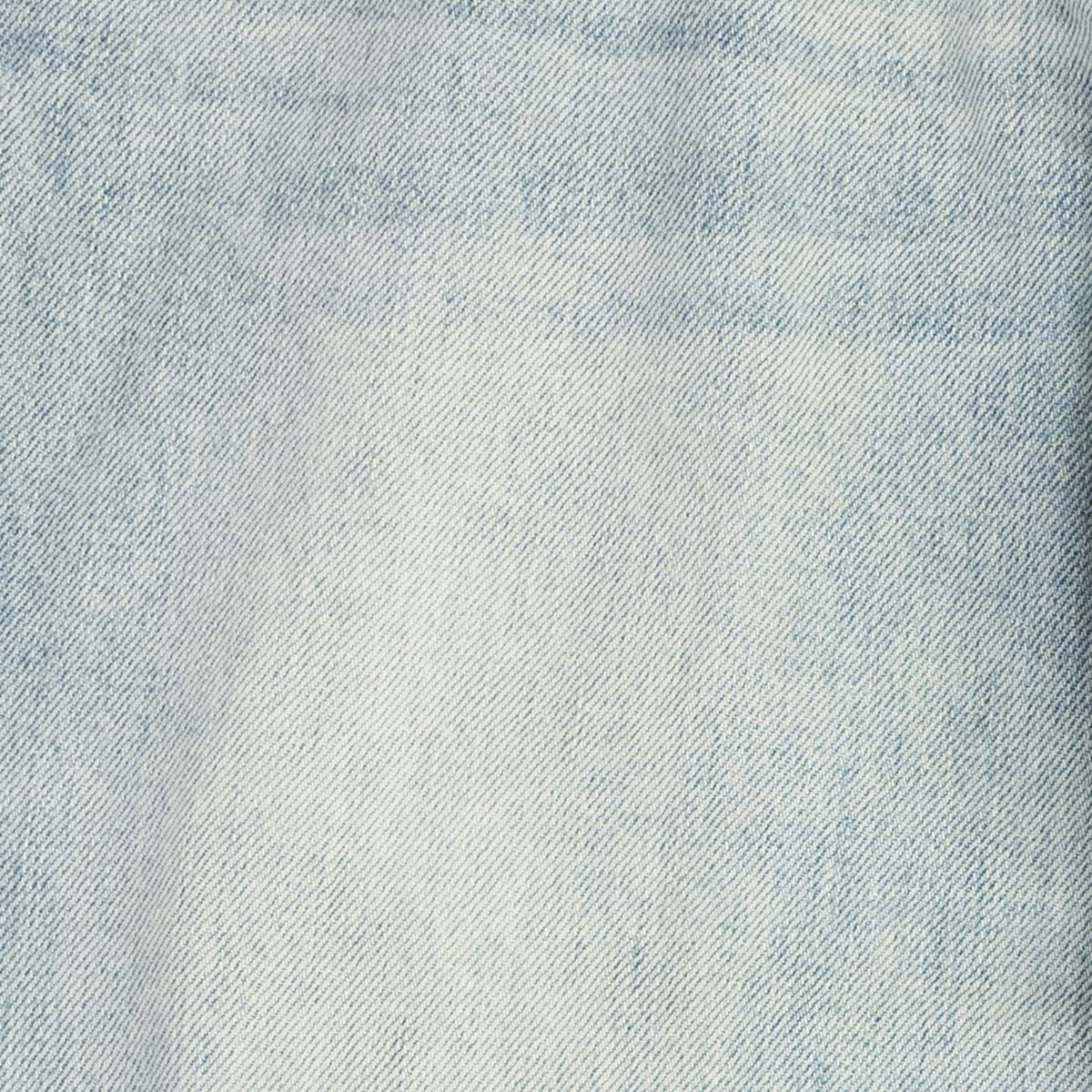A close-up texture shot of light blue denim fabric, showing the detailed twill weave and subtle fading.