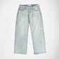 Light wash blue denim Bubblegum jeans with silver metal studs running down the outer seams of both legs, shown flat against a white background.