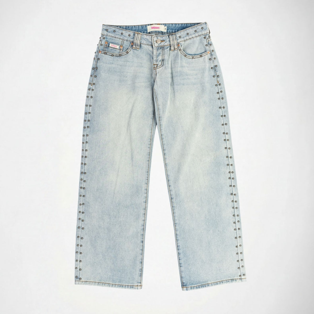 Light wash blue denim Bubblegum jeans with silver metal studs running down the outer seams of both legs, shown flat against a white background.