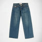 A pair of medium-wash blue denim Bubblegum jeans with silver-toned metal studs running down the outer seams of both legs, shown flat against a light gray background.