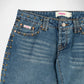Close-up of a pair of blue denim Bubblegum jeans with a gold-tone studs along the pocket edges and waistband, shown against a plain light background.