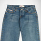 A pair of blue denim Bubblegum jeans with gold-toned metal studs running down the outer seams, shown against a plain white background.
